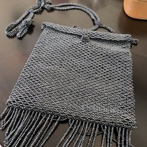 Small, hand beaded bag.